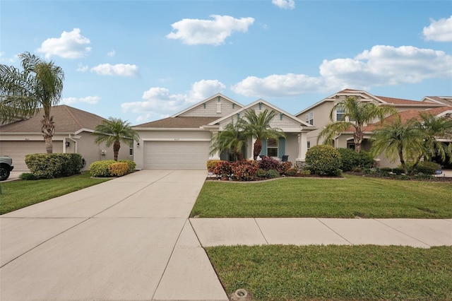 view of front of house featuring a front lawn and a garage