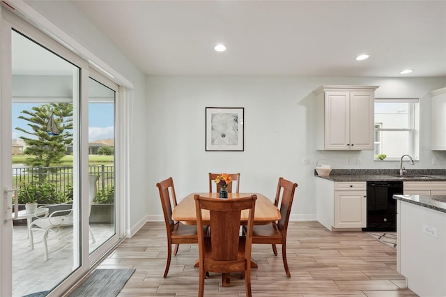 dining space with a wealth of natural light and sink