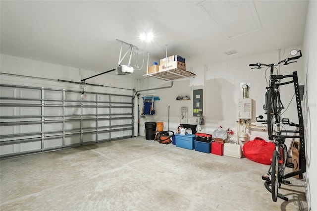 garage featuring a garage door opener and electric panel