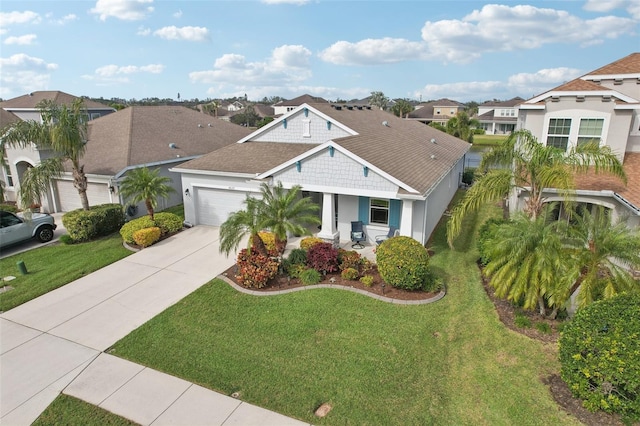 view of front of home featuring a front lawn and a garage