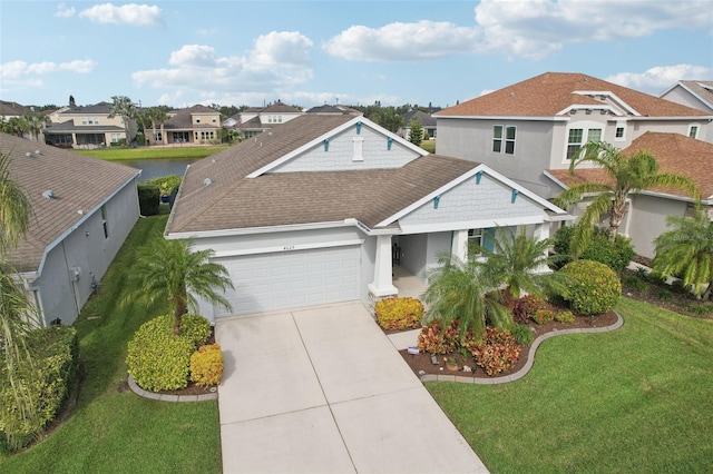 view of front of home featuring a front yard and a garage