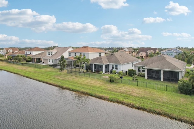 exterior space with a water view and a front yard