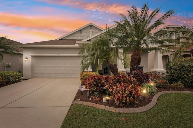 view of front of property with a garage