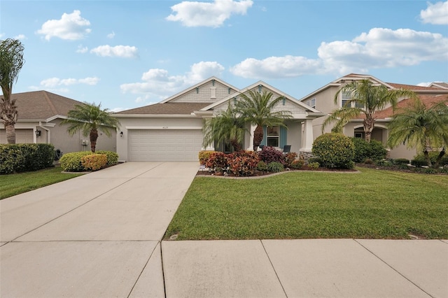 view of front of home featuring a garage and a front yard