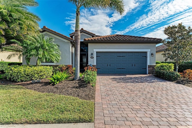 mediterranean / spanish-style house featuring a garage