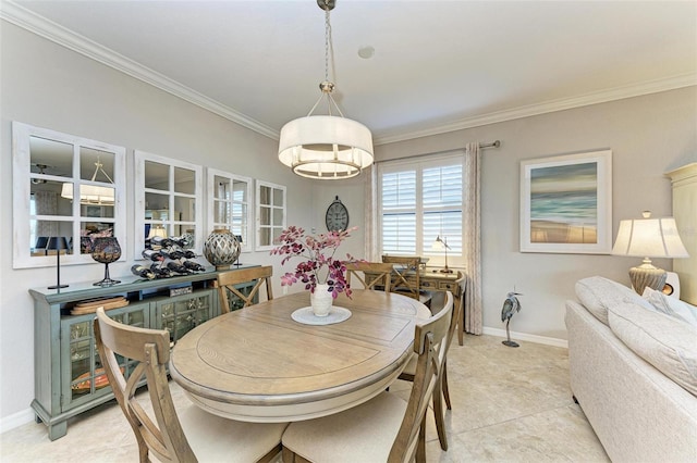 dining room featuring ornamental molding and light tile patterned floors