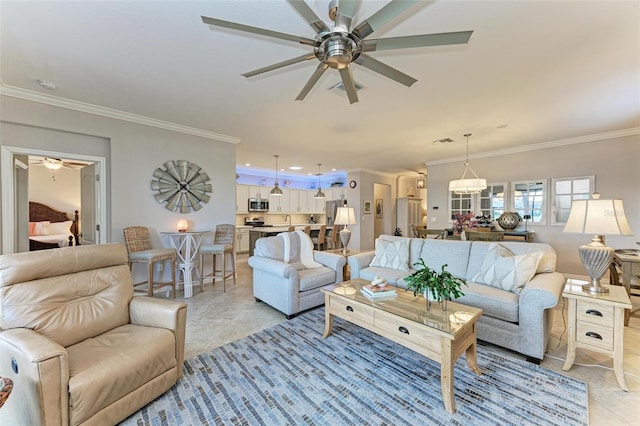 tiled living room featuring ornamental molding and ceiling fan