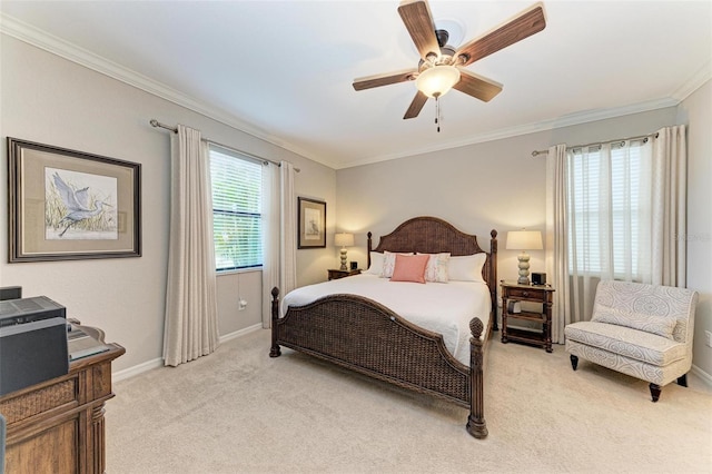 bedroom featuring ceiling fan, ornamental molding, and light colored carpet