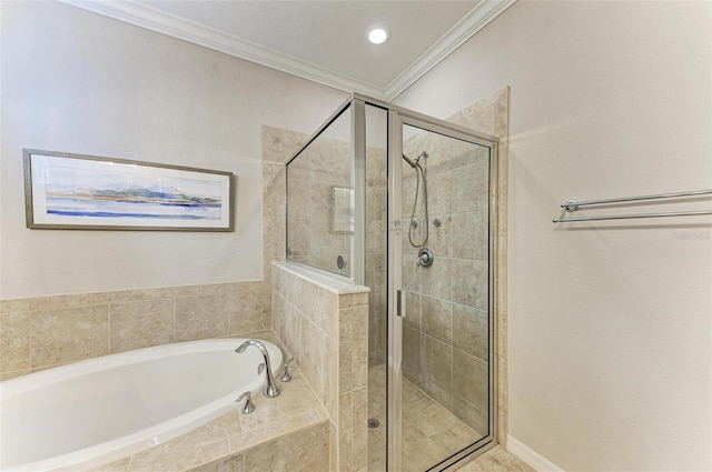 bathroom featuring ornamental molding and independent shower and bath