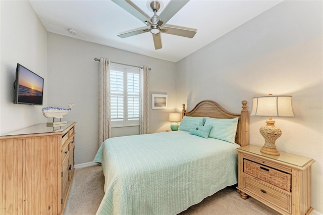 bedroom featuring ceiling fan and light colored carpet