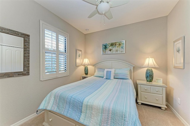 bedroom with light colored carpet and ceiling fan