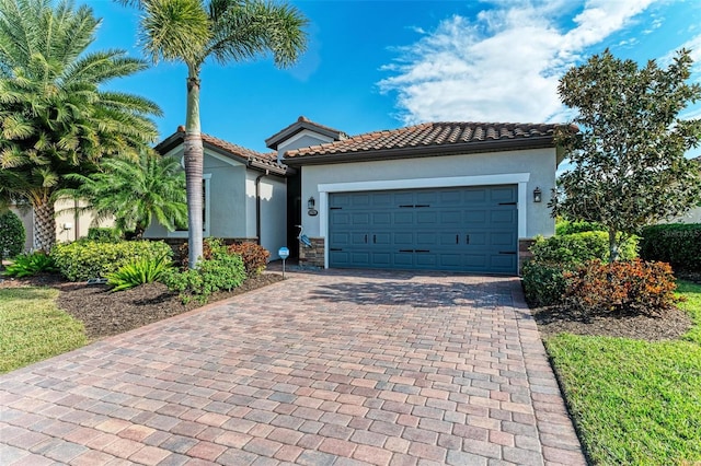 mediterranean / spanish house featuring a garage