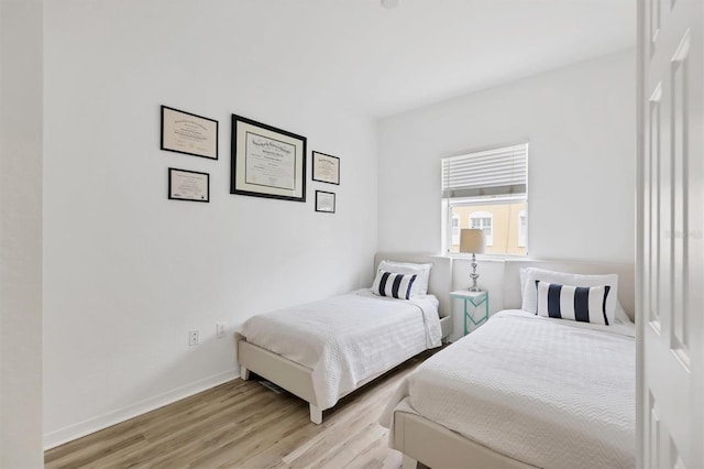 bedroom with light hardwood / wood-style floors