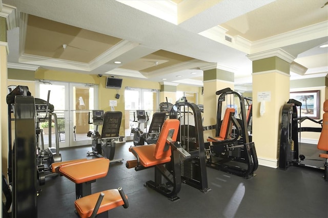 exercise room with crown molding and french doors