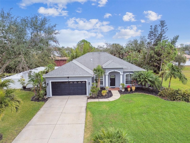 single story home featuring a front yard and a garage