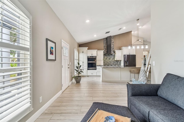 living room with vaulted ceiling