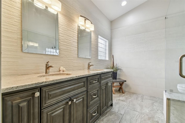 bathroom with lofted ceiling, vanity, and decorative backsplash