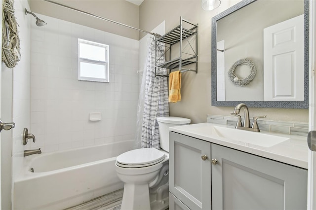 full bathroom with toilet, vanity, and shower / bath combination with curtain