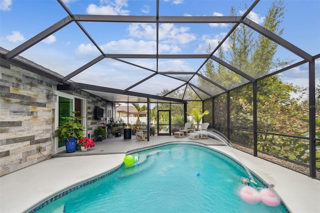 view of pool with a lanai and a patio