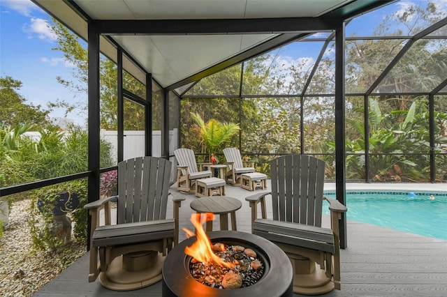 sunroom featuring a swimming pool