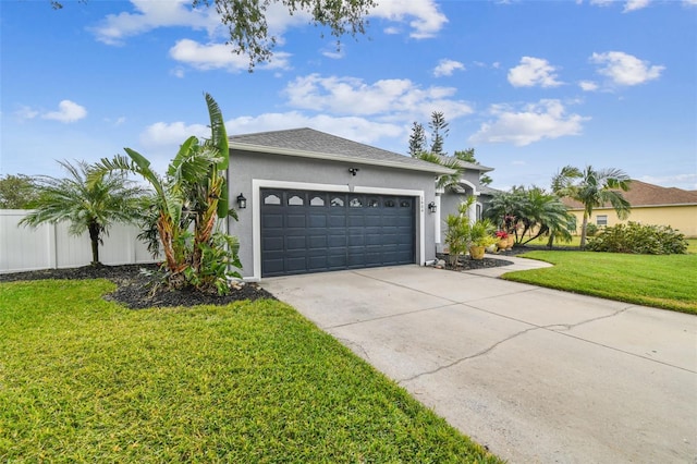 view of front of property with a garage and a front yard