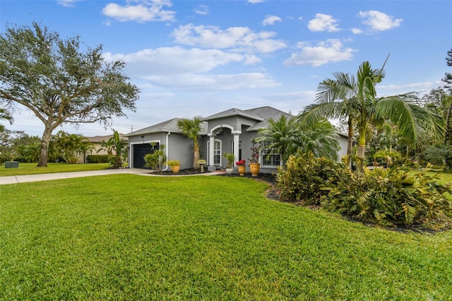 ranch-style home with a front yard and a garage