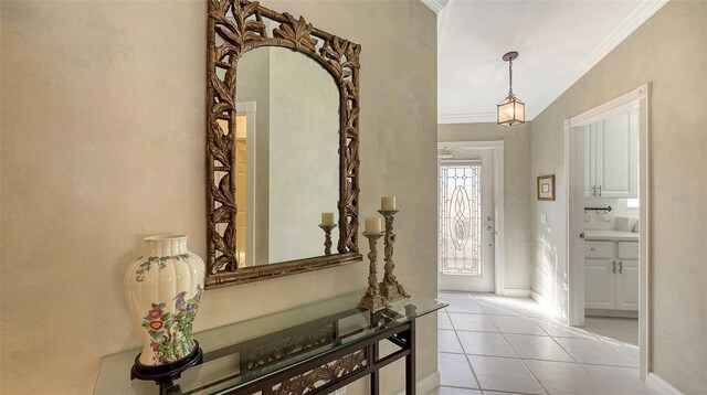 interior space with crown molding, lofted ceiling, and light tile patterned flooring