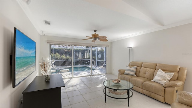 tiled living room with ceiling fan, lofted ceiling, and crown molding