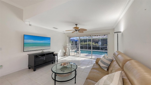 tiled living room with ceiling fan and crown molding