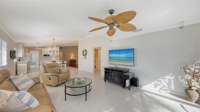 living room with ceiling fan with notable chandelier, ornamental molding, and light tile patterned floors