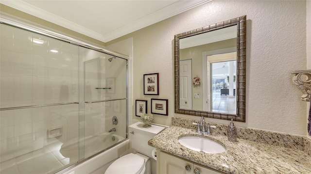 full bathroom with shower / bath combination with glass door, vanity, toilet, and crown molding