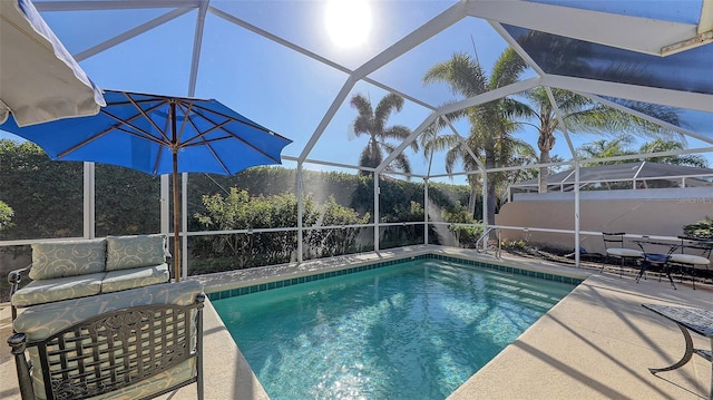 view of pool featuring a patio area and a lanai