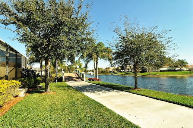 exterior space featuring a water view and a yard