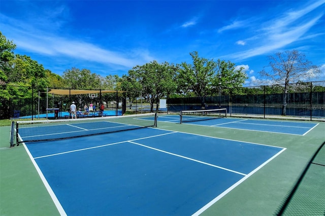 view of sport court featuring basketball hoop