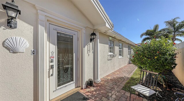 7575 Quinto Dr, Sarasota, FL 34238 - doorway to property featuring a patio area