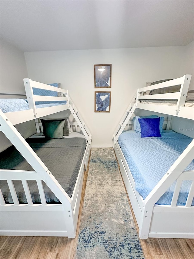 bedroom featuring wood-type flooring