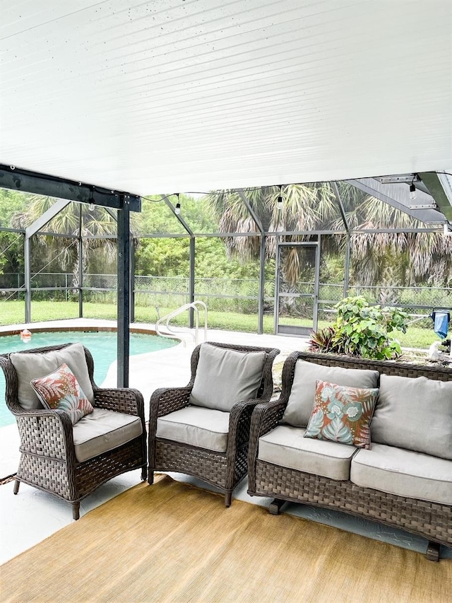 view of patio / terrace with outdoor lounge area and glass enclosure