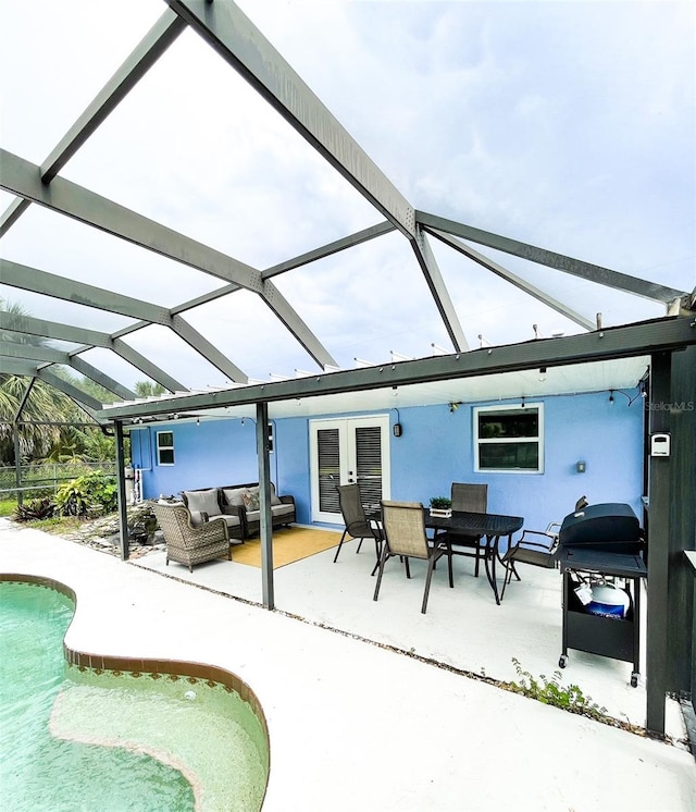 exterior space featuring a lanai, a patio area, and an outdoor hangout area