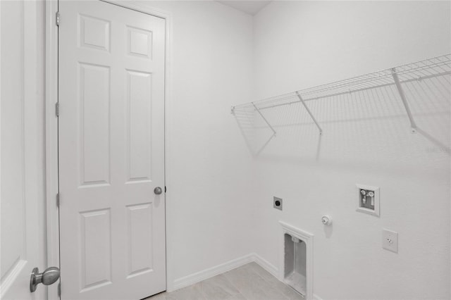 laundry room featuring gas dryer hookup, light tile patterned floors, electric dryer hookup, and hookup for a washing machine