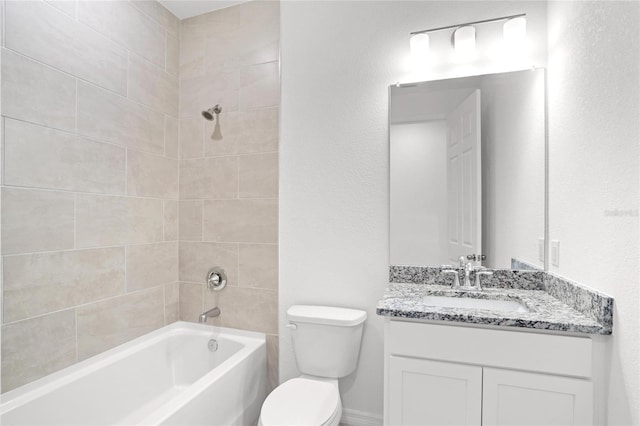 full bathroom featuring toilet, vanity, and tiled shower / bath combo