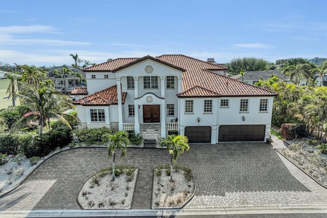 mediterranean / spanish house featuring a garage