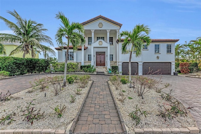 mediterranean / spanish-style house featuring a garage