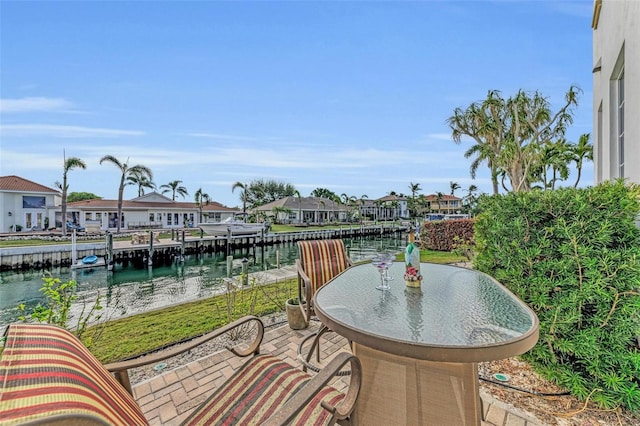 view of patio featuring a boat dock and a water view