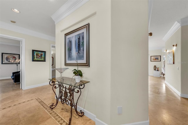 corridor with light tile patterned floors and ornamental molding