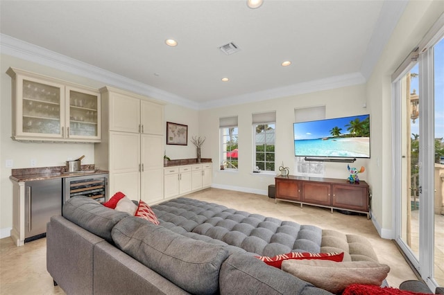 living room with wine cooler and ornamental molding