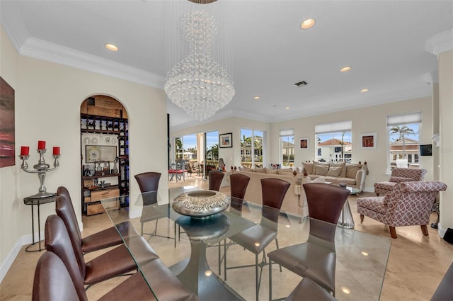 dining area featuring an inviting chandelier and ornamental molding