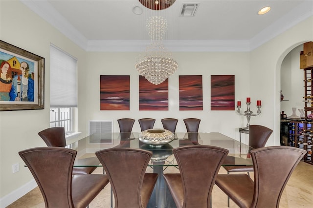 dining area with a notable chandelier and crown molding