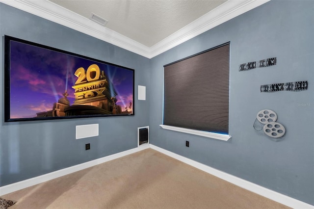 carpeted cinema with ornamental molding and a textured ceiling