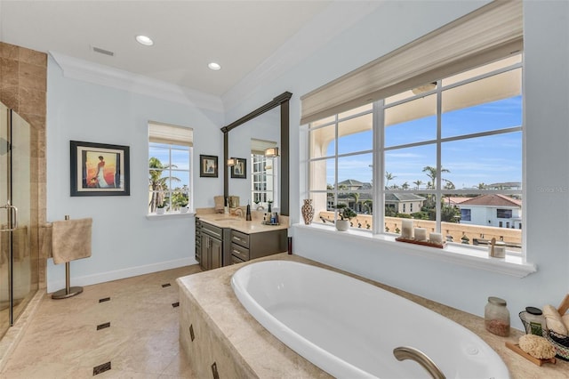 bathroom featuring vanity, crown molding, plus walk in shower, and a healthy amount of sunlight