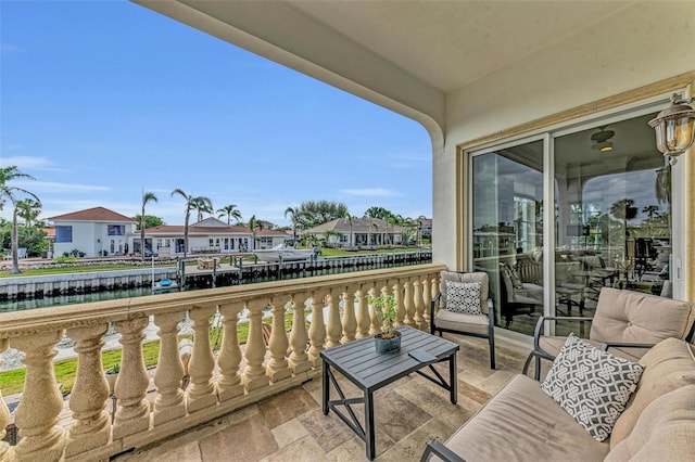 balcony featuring a water view